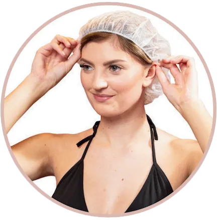 Lady applying hairnet